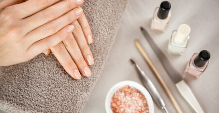 Woman,Fingers,With,Beautiful,Nails,On,Brown,Towel,With,Manicure